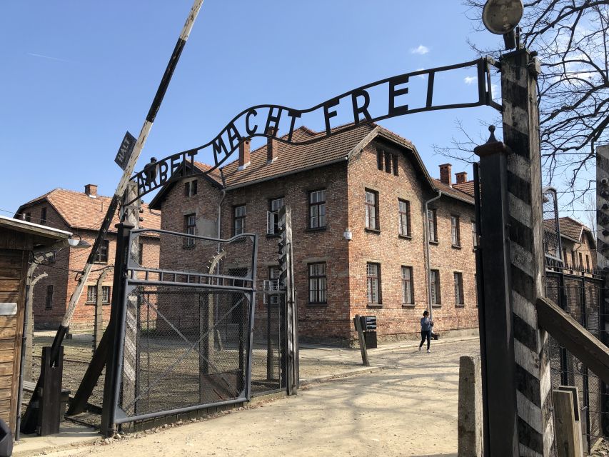 From Krakow: Auschwitz-Birkenau Guided Tour & Pickup - Auschwitz I: walking through Arbeit Macht Frei and the preserved layout