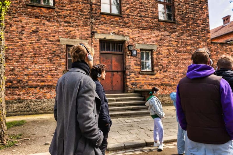From Krakow: Auschwitz-Birkenau Guided Tour & Transport - What to pack and how to handle the walking and waiting