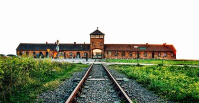 From Krakow: Auschwitz-Birkenau & Schindler's Factory Tour - On the bus: documentary context and headsets ready to go