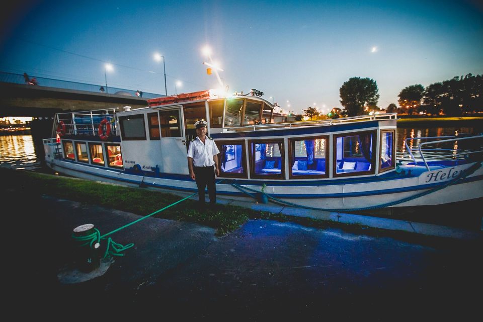 Krakow: Evening Cruise with a Glass of Wine - Back near Wawel: dragon statue, museum stop, and riverside parks