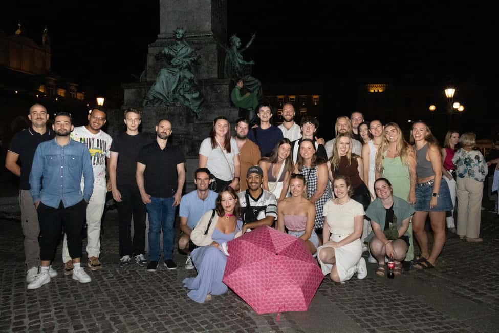 Krakow: Pub Crawl with Shots, Drinks & Skip-the-Line Entry - Where It Starts: Adam Mickiewicz Monument and the Pink Umbrella